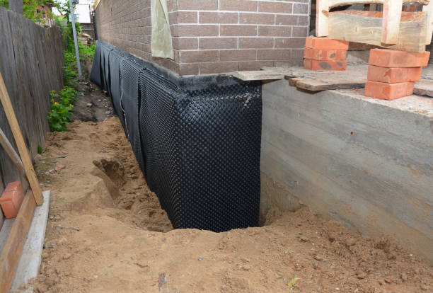 Happy homeowners after waterproofing job in Fairton